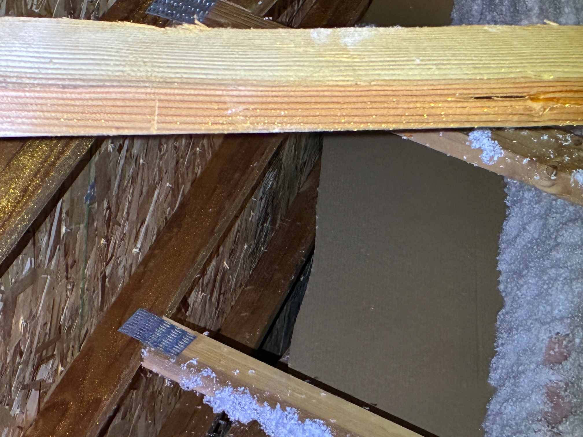 Mold growth on attic roof deck from poor ventilation