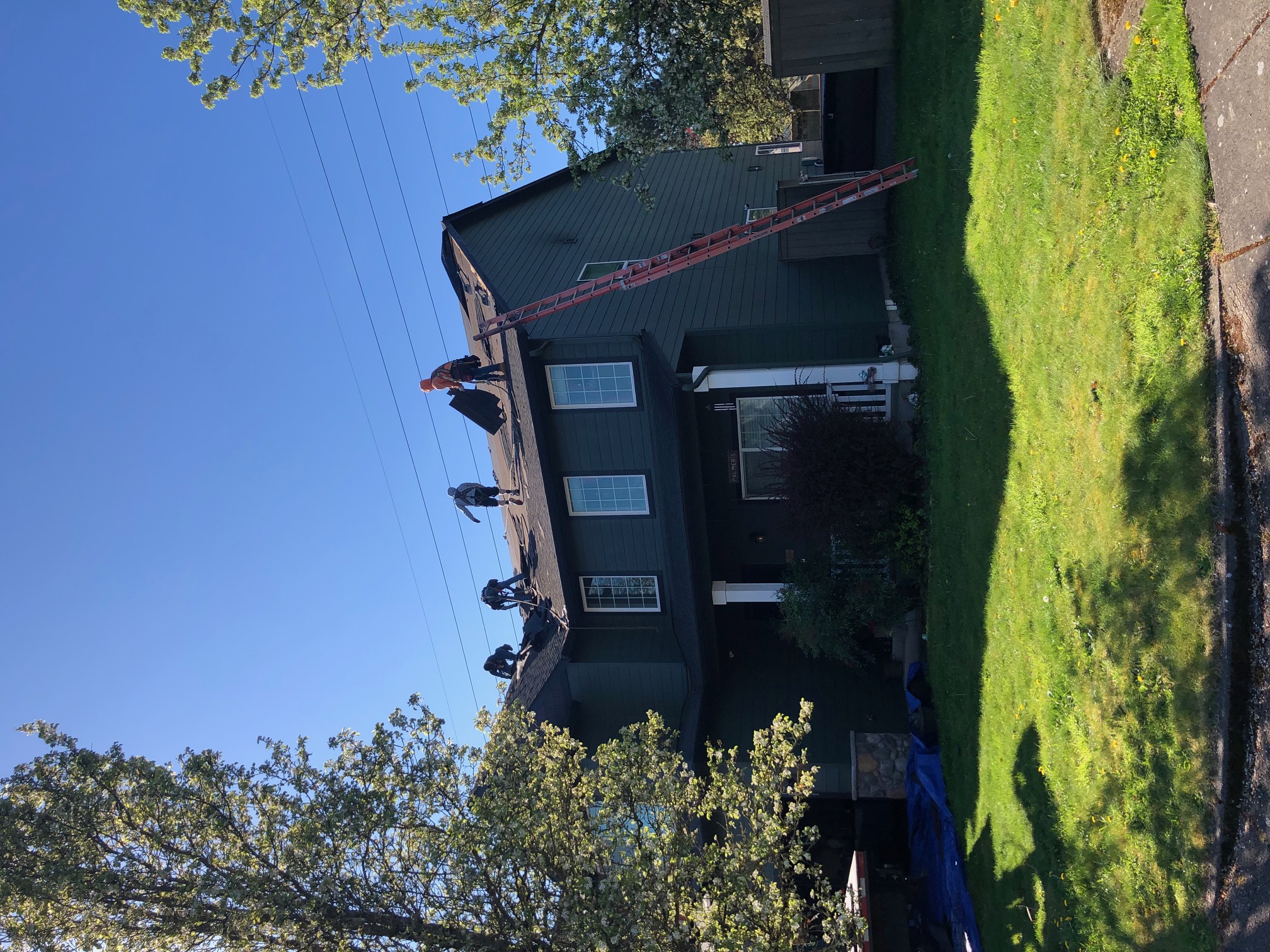 4th Dimension Roofing crew working on a residential roof in Clark County WA