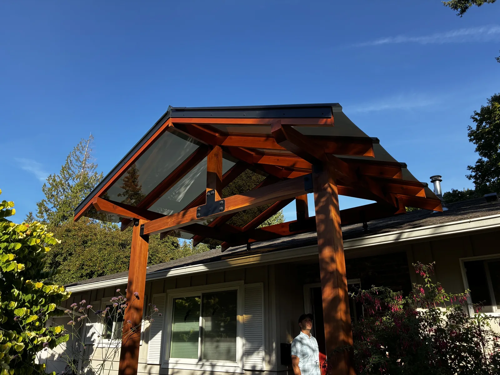 Completed timber gabled entryway portico with glass roof over a front door, Clark County WA