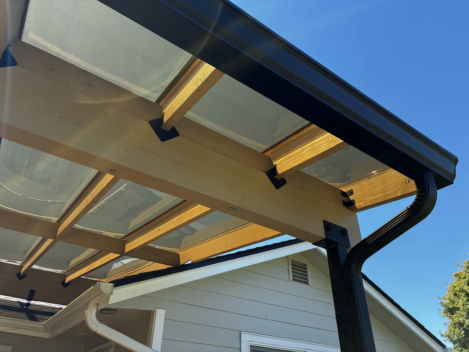 Finished covered patio with integrated gutter and downspout, Clark County WA