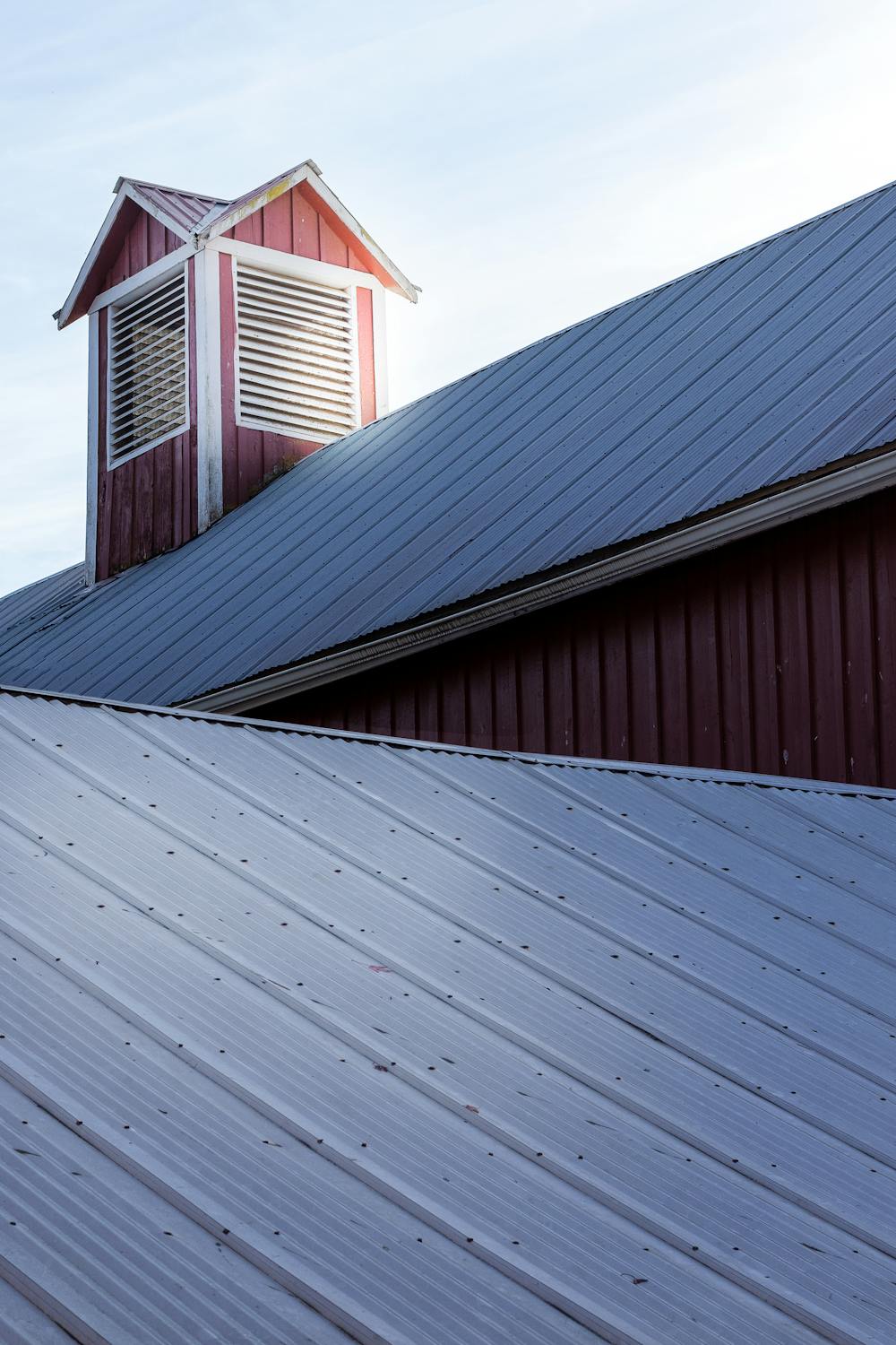 Standing seam metal roof showing the characteristic vertical ribbed panel pattern